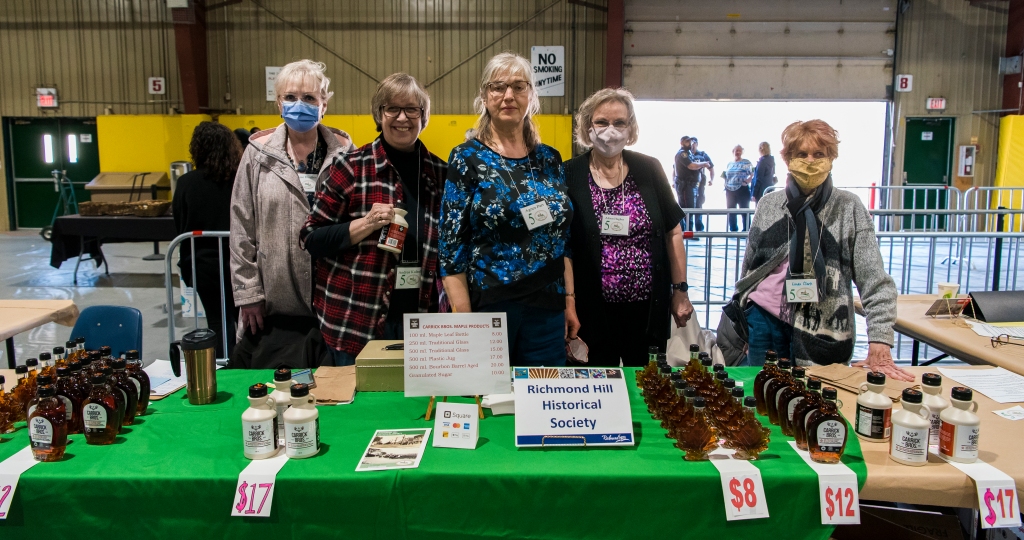 Denise Hughes, Andrea Kulesh, Agnes Parr, Alison Hughes and Linda Clark at the Richmond Hill Historical Society table with maple syrup for sale. (photograph courtesy of Chris Robart)