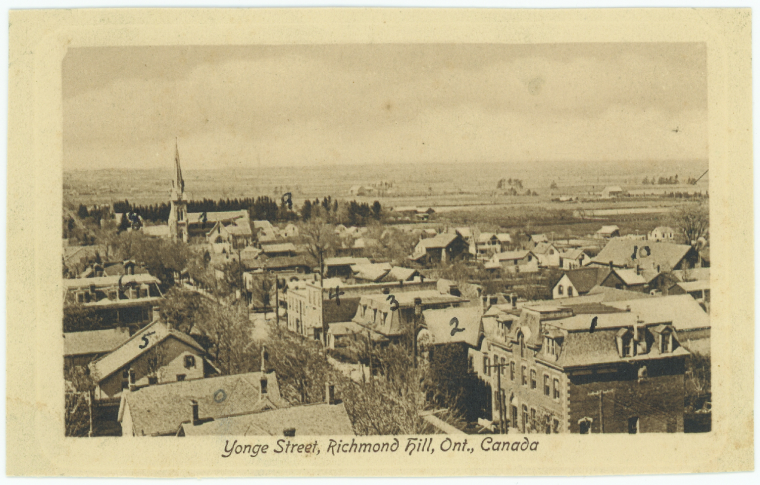 Postcard of Yonge Street looking north from the steeple of the Richmond Hill Presbyterian Church in 1908 from the Tweedsmuir History of Richmond Hill. (Richmond Hill Public Library, Tweedsmuir History Fonds)